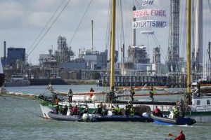 Dutch riot police prepare to board Greenpeace's Baluga II