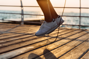 Close-up of person's legs in mid-air while rope-skipping