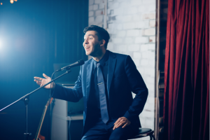 young man delivering standup comedy