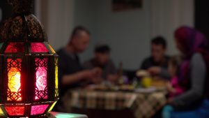 Muslim family celebrates their iftar meal with homemade dishes.