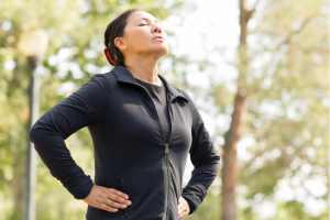 woman on a jog breathing deeply