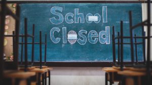 School closed due to COVID-19 outbreak and a message was posted on the school blackboard.