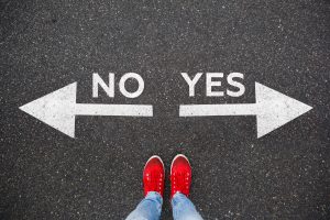 two feet stand between an arrow pointing left that says NO and an arrow pointing right that says YES