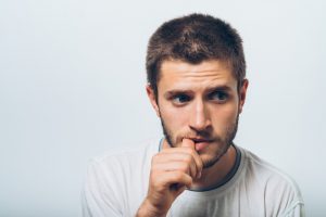 Man biting fingernails