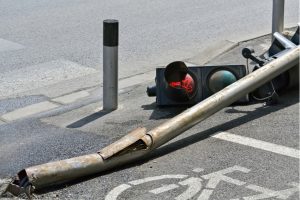 Traffic light on the ground after being hit by a vehicle