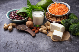 Vegetarian protein sources laid out on a dark table